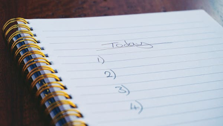 Photo of a note book with beginnings of a schedule