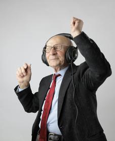 Photo of man with headphones dancing.